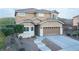Charming two-story home with a well-maintained front yard and an attached two-car garage at 2681 Benton Cove St, Laughlin, NV 89029
