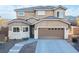 Charming two-story home features a well-maintained yard and an attached two-car garage at 2681 Benton Cove St, Laughlin, NV 89029
