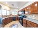 Well-lit kitchen with stainless steel appliances and a decorative tile floor design at 2681 Benton Cove St, Laughlin, NV 89029