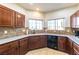 Spacious kitchen with ample counter space, wooden cabinetry, and dual windows at 2681 Benton Cove St, Laughlin, NV 89029