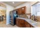 Kitchen area showcasing stainless steel refrigerator and plentiful counter space at 2681 Benton Cove St, Laughlin, NV 89029