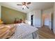 Comfortable bedroom includes wood floors, a ceiling fan, a walk in closet and neutral paint scheme at 2681 Benton Cove St, Laughlin, NV 89029