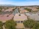 Aerial view of a well-maintained neighborhood featuring single-Gathering homes and desert landscaping, set against a mountain backdrop at 2765 Struan, Henderson, NV 89044