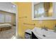 Bright bathroom with modern sink and large mirror, next to a bedroom with neutral color palette at 2765 Struan, Henderson, NV 89044