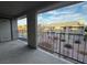 Apartment balcony overlooking a landscaped courtyard with seating areas at 2899 Bluebonnet Dr # 2899, Henderson, NV 89074