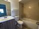 Cozy bathroom with neutral tile, shower head, and built-in tub at 2899 Bluebonnet Dr # 2899, Henderson, NV 89074