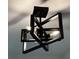 A modern, geometric ceiling light fixture illuminates the space at 2899 Bluebonnet Dr # 2899, Henderson, NV 89074