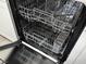 Interior of a dishwasher with wire racks and stainless steel interior at 2899 Bluebonnet Dr # 2899, Henderson, NV 89074