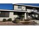Exterior view of a two-story apartment with well-kept landscaping at 2899 Bluebonnet Dr # 2899, Henderson, NV 89074