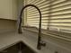 Close up of a modern stainless steel kitchen sink and faucet at 2899 Bluebonnet Dr # 2899, Henderson, NV 89074