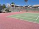 A well-maintained outdoor tennis court with vibrant green and red surfacing at 2899 Bluebonnet Dr # 2899, Henderson, NV 89074