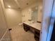 Bathroom featuring a modern vanity with a sink, a large mirror, and tiled floors at 29 Montelago Blvd # 336, Henderson, NV 89011