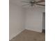 Bedroom featuring neutral carpeting, a ceiling fan, and an open doorway at 2981 Country Manor Ln # 118, Las Vegas, NV 89115