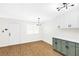 Bright kitchen with wood-look floors and views of the dining area at 304 Orland St # 43, Las Vegas, NV 89107