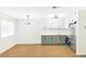 Open-concept kitchen with white cabinetry and stainless steel appliances at 304 Orland St # 43, Las Vegas, NV 89107