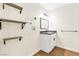 Well-organized laundry room with shelving and a sleek vanity at 304 Orland St # 43, Las Vegas, NV 89107