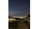 Street view with Las Vegas city lights visible in the distance at 310 Rain Quail Way, Henderson, NV 89012