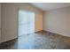 A sunny bedroom with tile flooring and a large sliding glass door at 3236 Idaho Springs St, North Las Vegas, NV 89032
