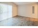 Bright bedroom with tile flooring, a large sliding glass door, and neutral walls at 3236 Idaho Springs St, North Las Vegas, NV 89032