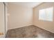 Cozy bedroom featuring tile floors, a window, and neutral walls at 3236 Idaho Springs St, North Las Vegas, NV 89032