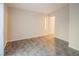 A clean bedroom featuring neutral walls, tile flooring, and a large closet at 3236 Idaho Springs St, North Las Vegas, NV 89032