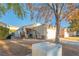 Charming single-story home with a well-maintained lawn and a detached garage at 3236 Idaho Springs St, North Las Vegas, NV 89032