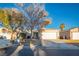 Charming single-story home with a well-maintained front yard and two-car garage at 3236 Idaho Springs St, North Las Vegas, NV 89032