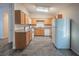 Bright kitchen with ample storage and a full set of appliances, including a refrigerator at 3236 Idaho Springs St, North Las Vegas, NV 89032