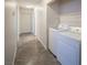 Bright laundry room featuring a full-size washer and dryer and neutral walls at 3236 Idaho Springs St, North Las Vegas, NV 89032