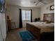 Cozy bedroom with a large wooden bed frame, soft carpet and window with black out curtains at 3681 Hidden Beach Ct, Las Vegas, NV 89115