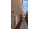 Side exterior view of a home with a walkway and gate leading to the backyard at 3681 Hidden Beach Ct, Las Vegas, NV 89115