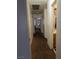 Hallway features neutral walls, brown carpet, and doors leading to various rooms at 3681 Hidden Beach Ct, Las Vegas, NV 89115