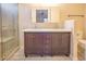 Bathroom featuring double sink vanity with modern fixtures and a walk-in shower with glass door at 3725 Shanagolden St, Las Vegas, NV 89129