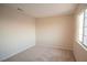 Neutral bedroom with carpeted floors, window, and ample natural light at 3725 Shanagolden St, Las Vegas, NV 89129