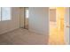 Carpeted bedroom featuring an ensuite bathroom, closet with mirrored sliding doors and access to the staircase at 3725 Shanagolden St, Las Vegas, NV 89129