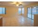 Dining area with tiled floors, natural light, and access to the backyard through sliding glass doors at 3725 Shanagolden St, Las Vegas, NV 89129