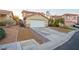 Charming home with a two-car garage, desert landscaping and a concrete driveway at 3725 Shanagolden St, Las Vegas, NV 89129