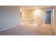 Large hallway with carpet and multiple entrances to various rooms at 3725 Shanagolden St, Las Vegas, NV 89129