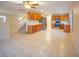 Spacious kitchen with tiled floor, wooden cabinets, stainless steel appliances, and ample counter space at 3725 Shanagolden St, Las Vegas, NV 89129