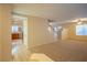 Open-concept living room, tile floors, staircase to the upper level, and access to the kitchen at 3725 Shanagolden St, Las Vegas, NV 89129
