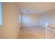 Upstairs loft area with neutral walls, carpet, and a window at 3725 Shanagolden St, Las Vegas, NV 89129