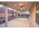 Covered patio featuring ceiling fans, concrete flooring, desert landscaping and a view of the backyard at 3725 Shanagolden St, Las Vegas, NV 89129