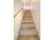 Carpeted staircase with white railing leads to the upper level of the home at 3725 Shanagolden St, Las Vegas, NV 89129