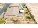 An aerial view of the backyard featuring desert landscaping, covered patio, and turf at 3914 Jacob Lake Cir, Las Vegas, NV 89118