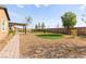 Spacious backyard with desert landscaping and a turf at 3914 Jacob Lake Cir, Las Vegas, NV 89118