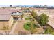 Backyard showcasing a covered patio, fire pit, desert landscaping, and a clear view of the city skyline at 3914 Jacob Lake Cir, Las Vegas, NV 89118