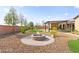 Backyard features a circular firepit and desert landscaping at 3914 Jacob Lake Cir, Las Vegas, NV 89118