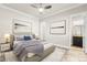 Staged bedroom with neutral walls, ensuite bathroom and views at 3914 Jacob Lake Cir, Las Vegas, NV 89118