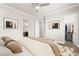 Staged bedroom features a bed, closet and access to an ensuite bathroom at 3914 Jacob Lake Cir, Las Vegas, NV 89118