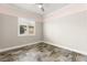Bedroom featuring ample natural light and unique tile flooring at 3914 Jacob Lake Cir, Las Vegas, NV 89118